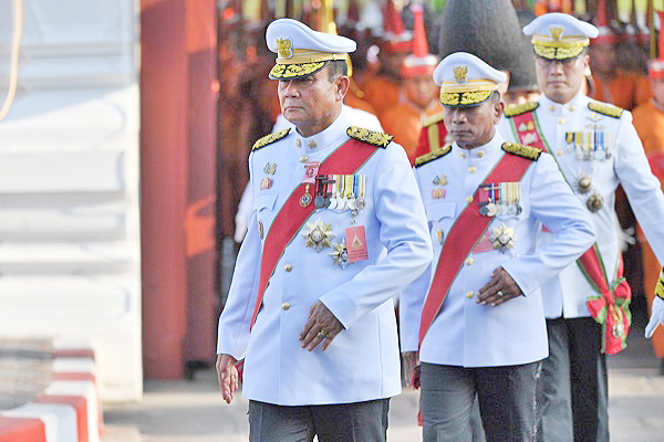 A file photo shows Thailand’s Prime Minister Prayut Chan-O-Cha (left) taking part in the coronation procession for King Maha Vajiralongkorn in Bangkok on May 5. Photo: ACP