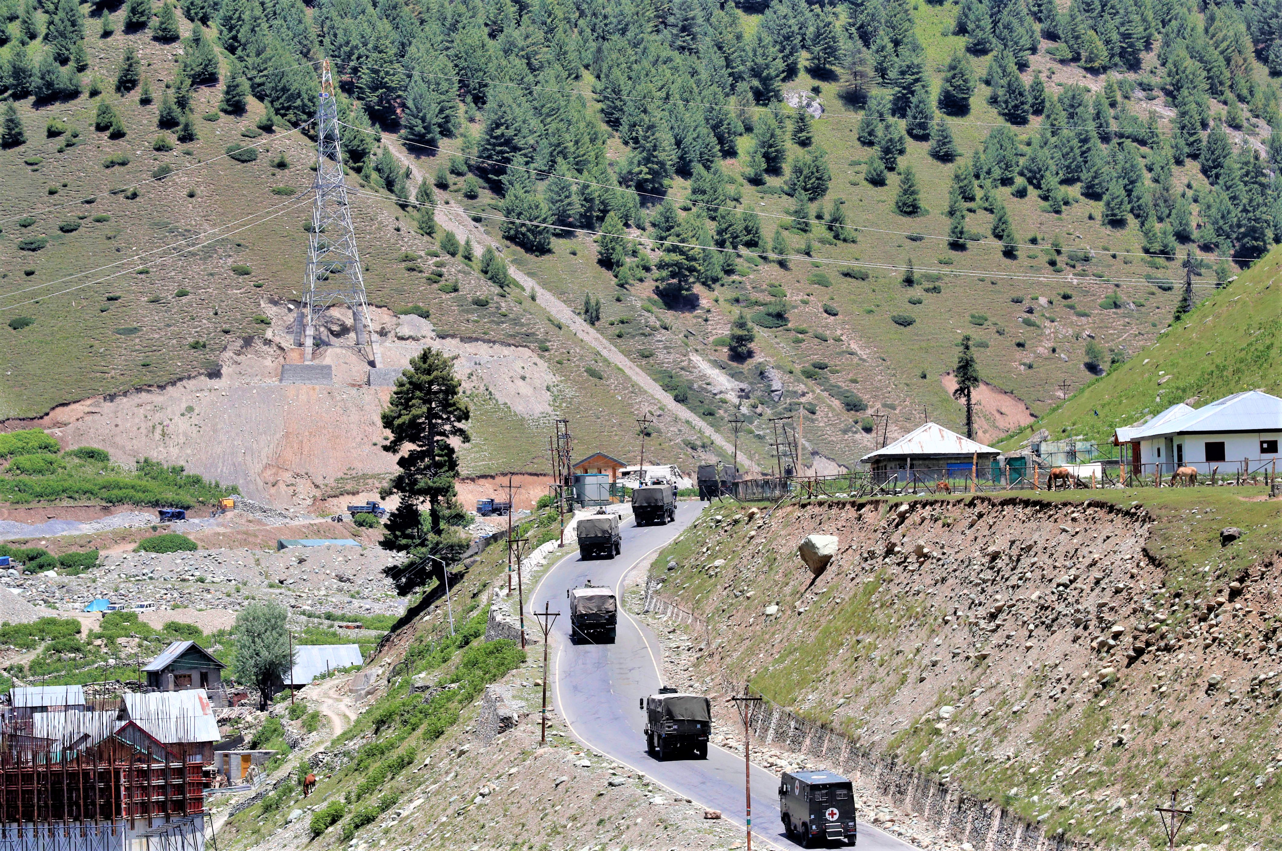 Indian army convoy moves along Srinagar-Leh national highway, at Gagangeer, in east Kashmir's Ganderbal district